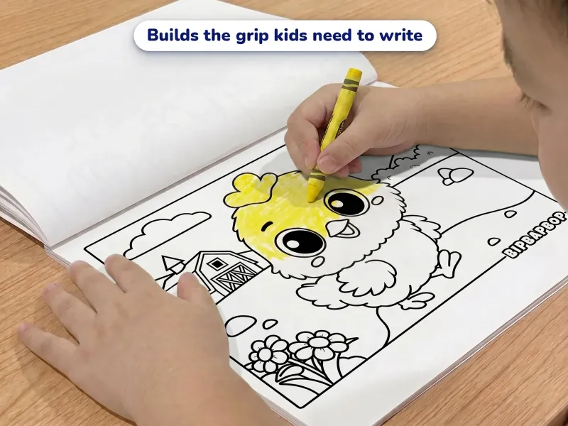 Child with a yellow crayon coloring a picture of a chick in front of a farm barn