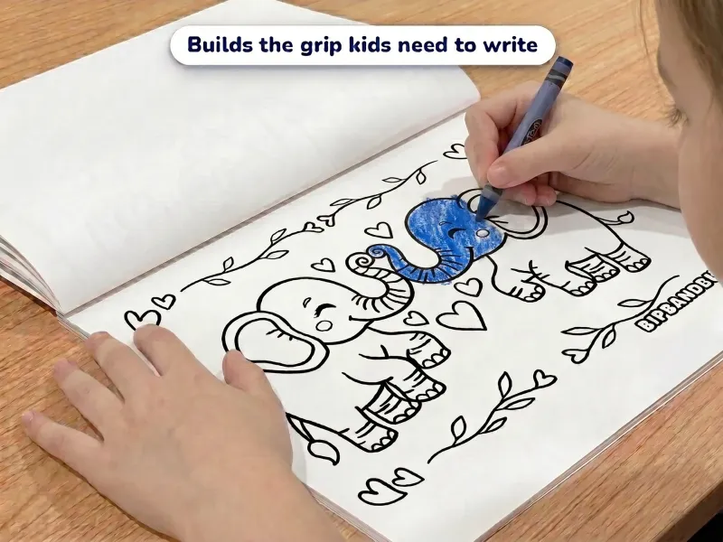 Child with a crayon coloring a picture of two elephants making a heart shape with their trunks