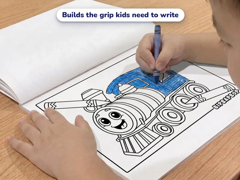 Child with a crayon coloring a picture of a happy train