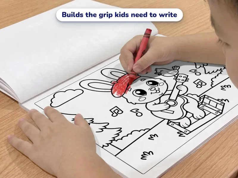 Child with a crayon coloring a picture of a bunny playing the guitar in the woods